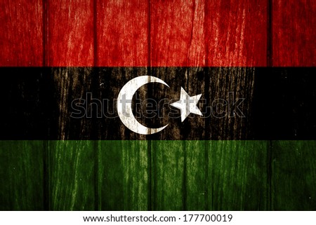 Libya Flag on old wood background 