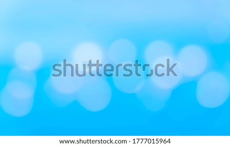 Blurred light blue circle bokeh background, out of focus