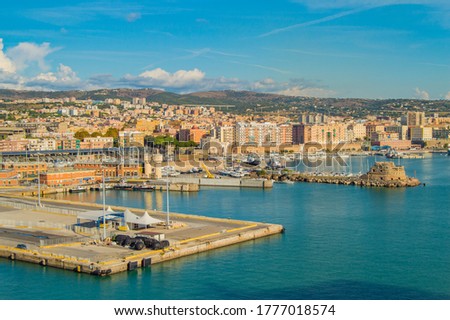 View of Civitavecchia, Rome's cruise and ferry port. City in the background, Sunny day, view from the sea Royalty-Free Stock Photo #1777018574