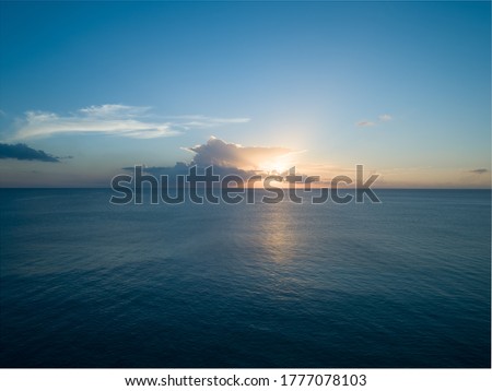 Aerial sunset photo looking outward from Batts Rock beach in Barbados Royalty-Free Stock Photo #1777078103