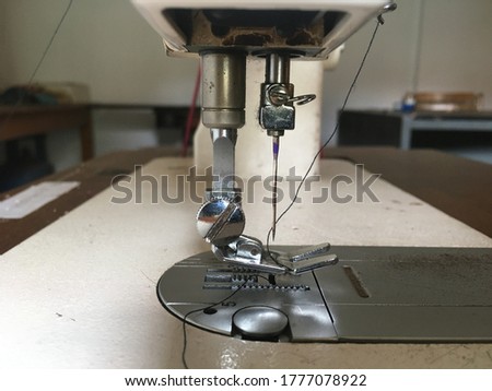 Closeup mechanism of domestic sewing machine 