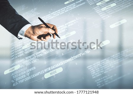 Multi exposure of businessman hand with pen working with abstract graphic coding sketch on blurred office background, big data and networking concept