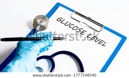 text GLUCOSE LEVEL with stethoscope ,medical concept.business concept