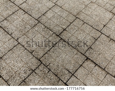 detail of tiles at the street gives a harmonic pattern 