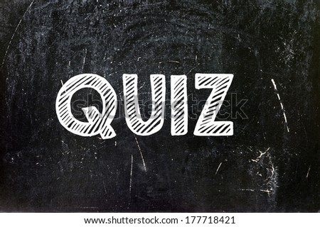 Quiz written with chalk on blackboard education concept