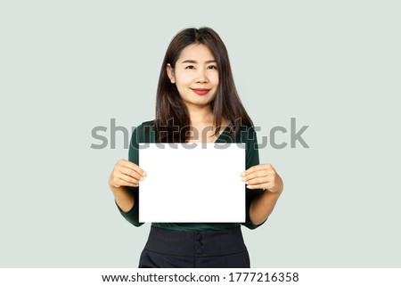  beautiful Asian business woman hand holding  blank sheet paper for advertising, mock up 