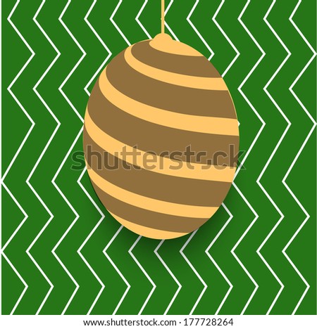 Hanging Easter egg on green background. Royalty-Free Stock Photo #177728264