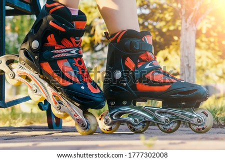 Young nice girl in roller skates. close up. Resting and fun concept