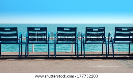 Deck Chairs in front of the sea, Nice, France Royalty-Free Stock Photo #177732200