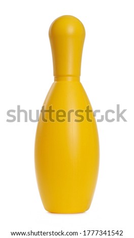 Yellow standing bowling pin, skittle isolated on white background
