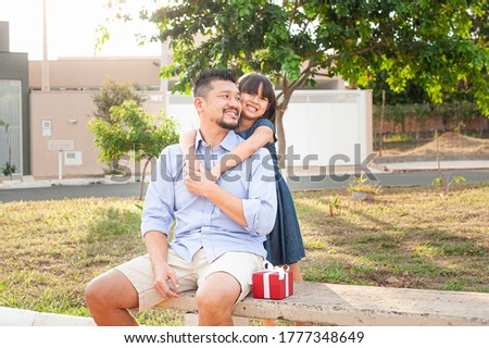 Father and daughter outdoors. Showing affection and love. Father's Day.