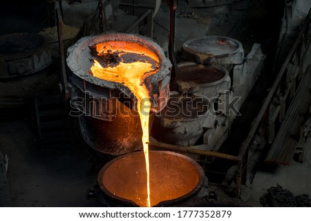 Tank pours liquid metal at the steel mill Royalty-Free Stock Photo #1777352879