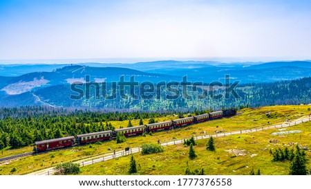 The "Brockenbahn", a Steamtrain, is climbing to the Top of the Brocken-Mountain Royalty-Free Stock Photo #1777376558