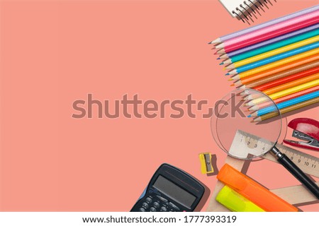 School colored stationery on a pink background.