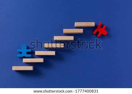 human figure climbing stairs, concept of career growth and job loss, unemployment