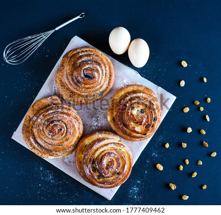 Delicious cinnabon buns. Buns with poppy seeds and raisins. Rouge Baking