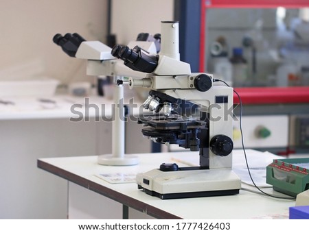 Picture of an optical microscope in a scientific laboratory used for research. Concept of science, medicine and biology. Medical technolgoy and concept of investigation and pharmaceutical development.