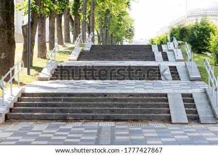 Pedestrian road and steps for the disabled in the city.