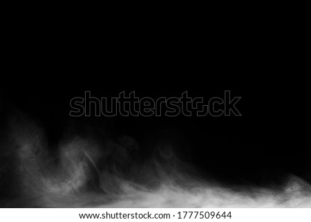 Blur white water vapour on isolated black background. Abstract of steam with copy space. Steam flow. Smoke on black background. Royalty-Free Stock Photo #1777509644