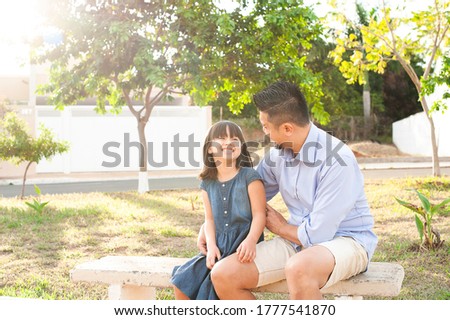 Father and daughter outdoors. Showing affection and love. Father's Day.