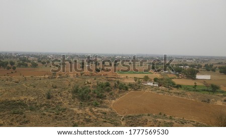 open green land view from mountain hill with blue sky