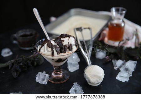 
homemade sauce ice cream on black ground