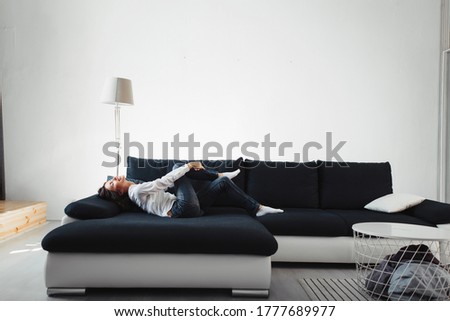 girl woman lies on couch relaxed smile stretches good positive weekend one bright day