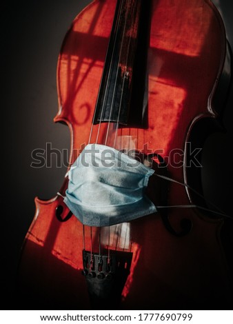The cello with protective mask 