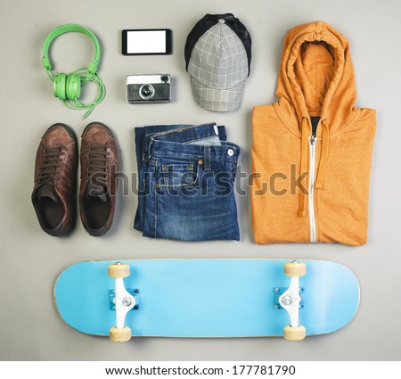 Overhead of essentials casual boy./ Outfit of skater man on grey background.  Royalty-Free Stock Photo #177781790