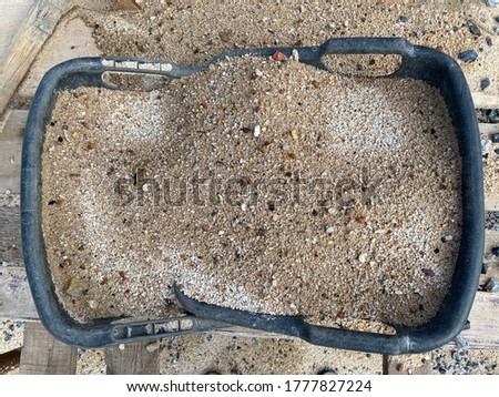 Buckets of sand on the ground , top view