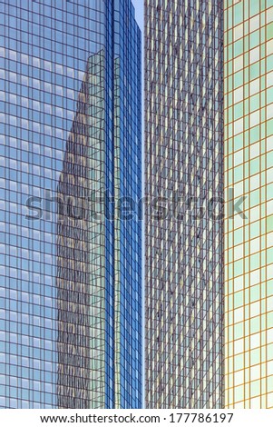 reflection of the sun in the facade of a skyscraper