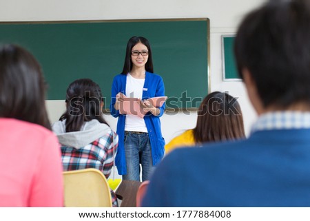 College teacher and students in the classroom
