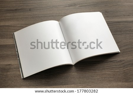 Photo blank. Open square format brochure on a wooden table Royalty-Free Stock Photo #177803282