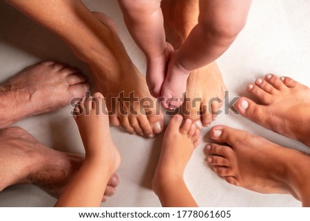 female legs of 4 generations of one family.  baby, child, mom, grandmother, great-grandmother Royalty-Free Stock Photo #1778061605