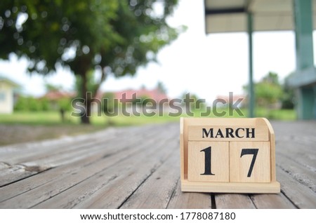 March 17, Number cube with a natural background.