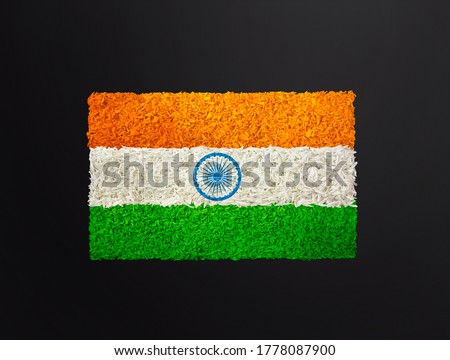 India flag created with natural flowers, India flag decorated with natural flowers,
tri colour flag on black background