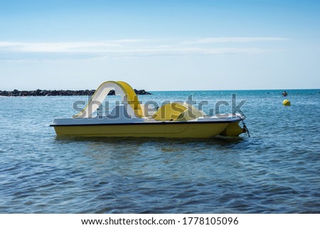 Closeup of plastic pedalo in the sea on blus sky background Royalty-Free Stock Photo #1778105096