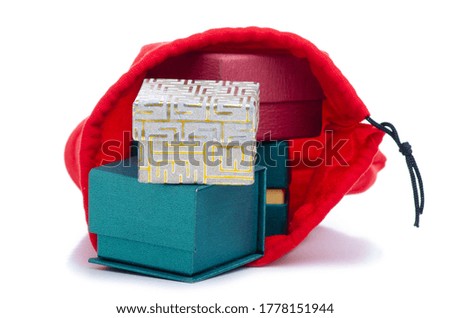jewelry boxes in red gift bag pouch on white background isolation