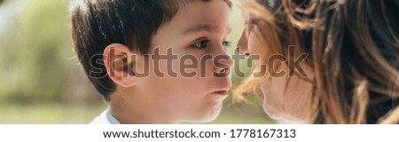 website header of cute boy looking at mother