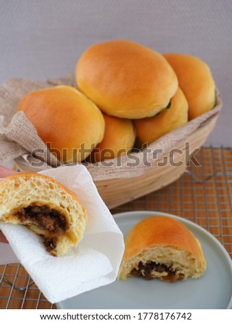 Freshly baked of home made Roti Baso or Seasoned Meat Sweet Bread. Close up and selective focus  