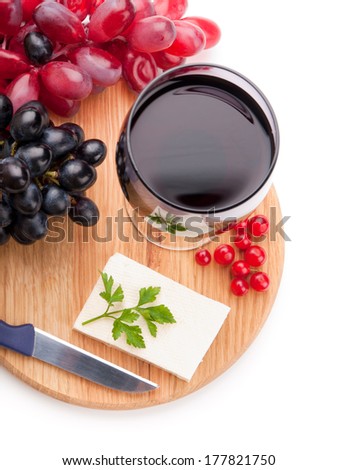 Red wine, sheep cheese and grapes isolated on white background