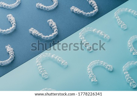 Transparent invisible dental aligners or braces aplicable for an orthodontic dental treatment Royalty-Free Stock Photo #1778226341