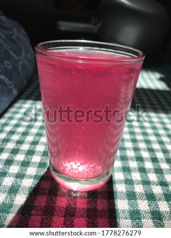 Vitamin C served in glass cup, healthy lifestyle on green white table buying now.