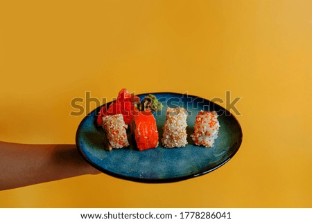 Set Of Assorted Sushi Served Plastic Box On Table. Food Delivery