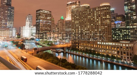 Chicago buildings, towering from street level around Chicago River and urban roads, Columbus Drive Bridge and street light streams Looking from east side to north and high-rise apartments, hotels 