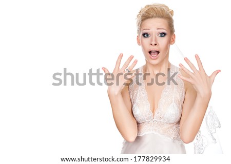 Bride opened her mouth in surprise and waving his hands on his eyes wide. Royalty-Free Stock Photo #177829934