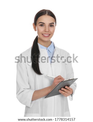 Happy young woman in lab coat with clipboard on white background Royalty-Free Stock Photo #1778314157