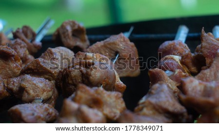 Picture of meat being cooked on fire