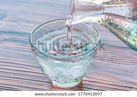 Japanese Sake poured in a transparent glass