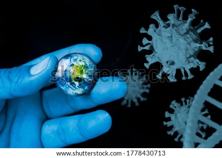 close up blue color hand is holding the earth planet on a black background with covid-2109 virus graphic, Element of this image furnished by Nasa
